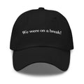 Black baseball cap with white embroidered text dad hat