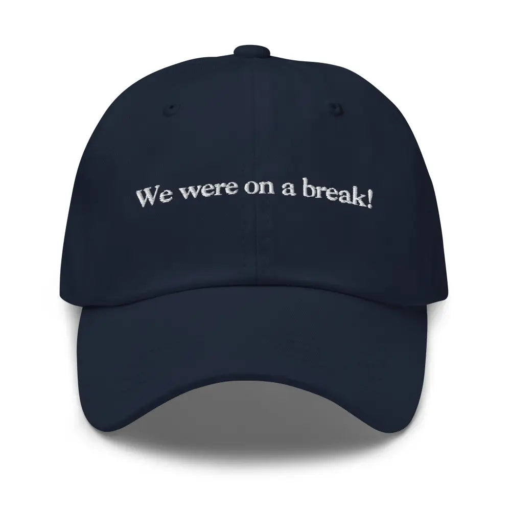 Navy blue embroidered dad hat with white text