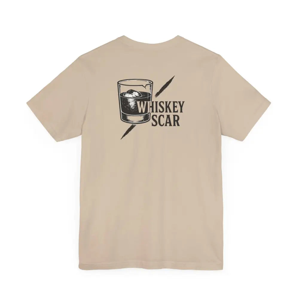 Light brown Trini Skies t-shirt with whiskey glass, Iron Line Series