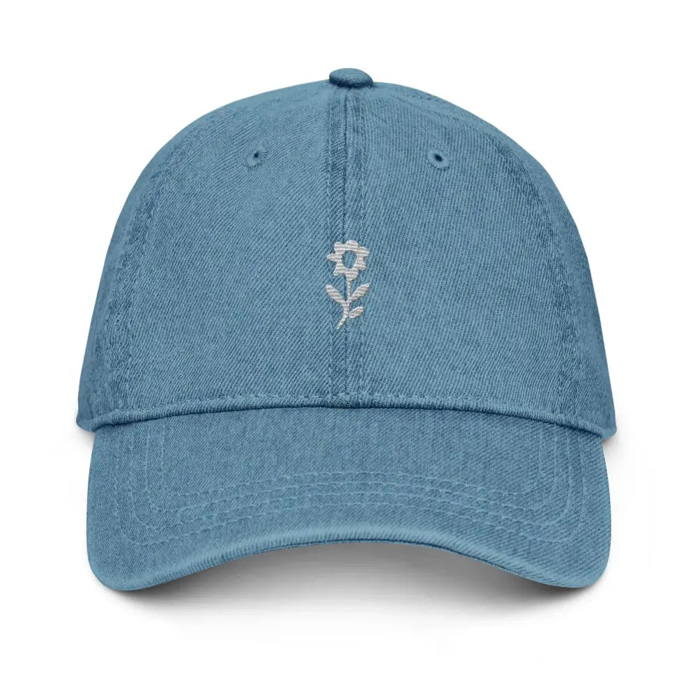 Light blue denim baseball cap with white embroidered wildflower minimalist design by Trini Skies Supply