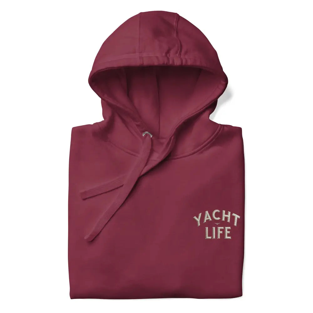 Folded maroon hoodie with yacht life embroidered drawstrings by Trini Skies