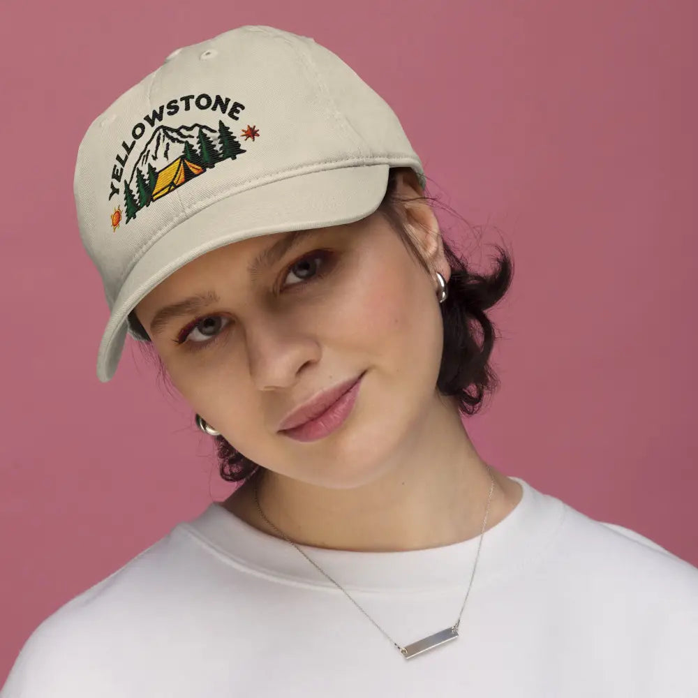 Woman wearing Yellowstone organic cotton camping unstructured cap with embroidery and Trini Skies