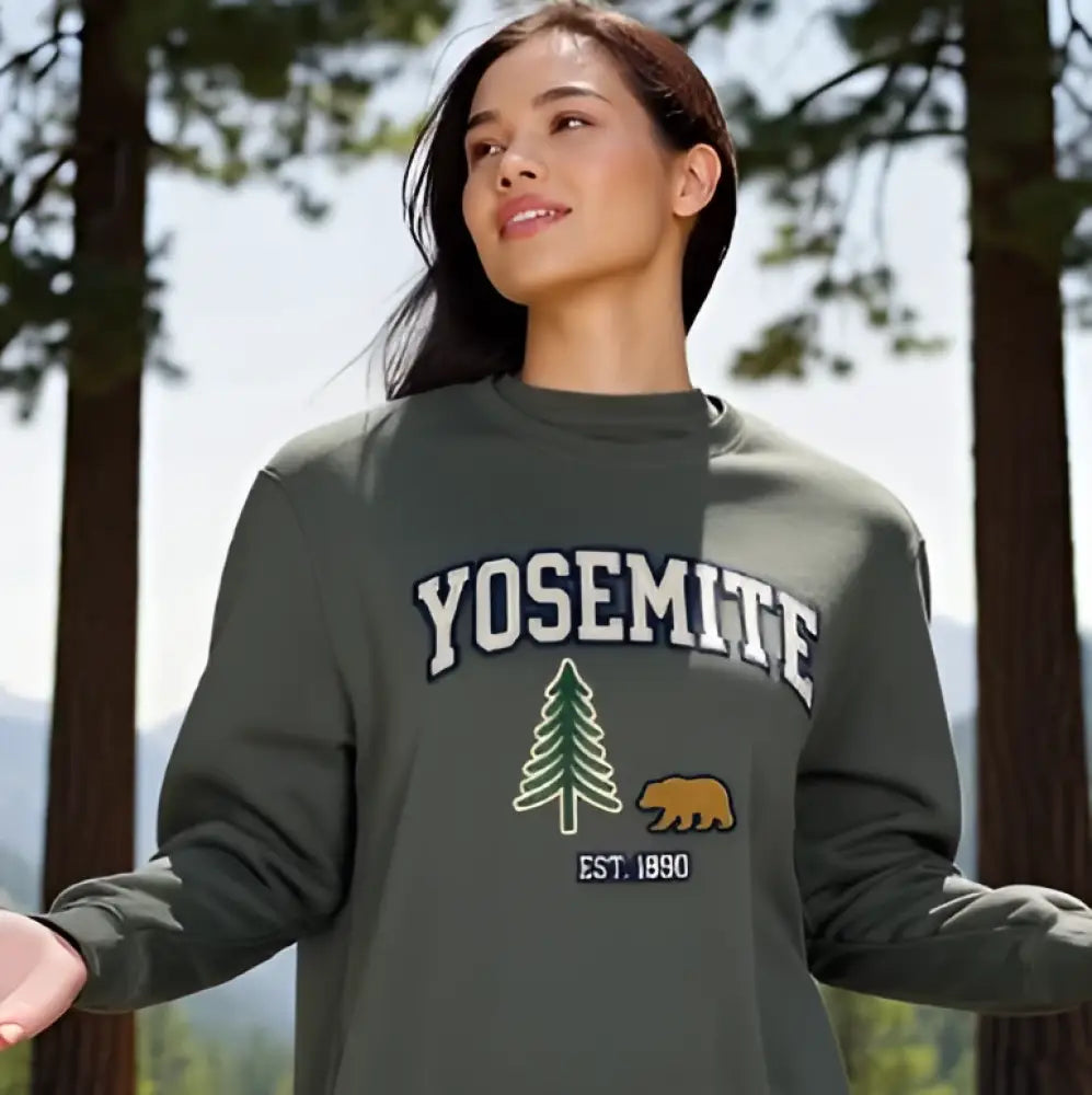 Olive green Yosemite National Park sweatshirt with bear and tree design, established 1890